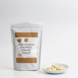 Freeze-dried ground ginger tablet pouch with bowl of chopped ginger tablets