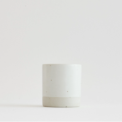 Sando shot cup, white cylindrical cup with speckled lower band.