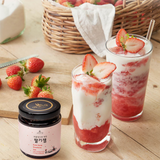 Strawberry jam drink cups with ice and strawberries, plus a small jam jar
