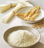 White rice grains in bowl for gluten-free flat rice noodles