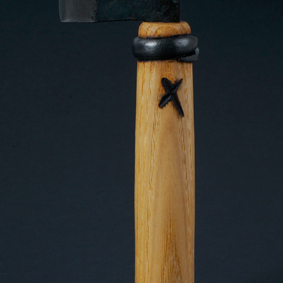 Wooden knife handle with star mark and black collar.