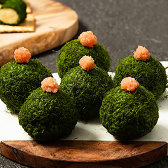 Green herb balls topped with small pink pieces