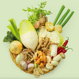 Vegetable stock powder sticks with assorted vegetables shown in a basket