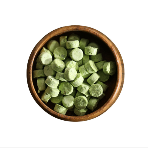 Chopped Cheongyang chili pepper pieces in a wooden bowl, pale green