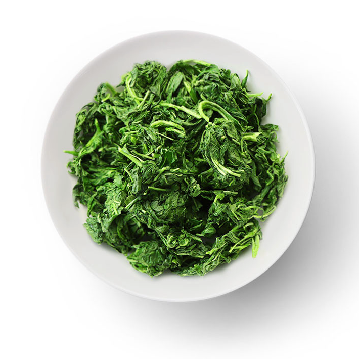 Freeze-dried green leafy namul greens in a white bowl