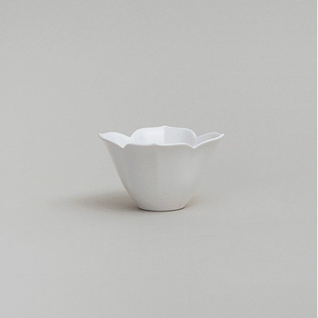 Flower tiny bowl set: small white flower-shaped bowl with a wavy rim.