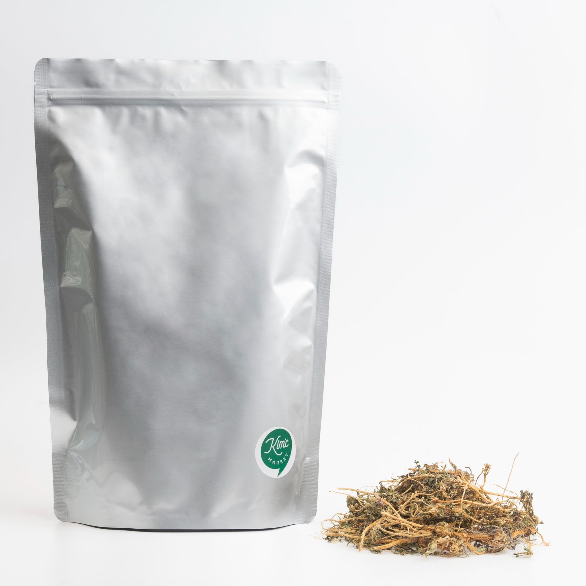 Dried shepherd's purse herb pouch with loose dried stems and leaves