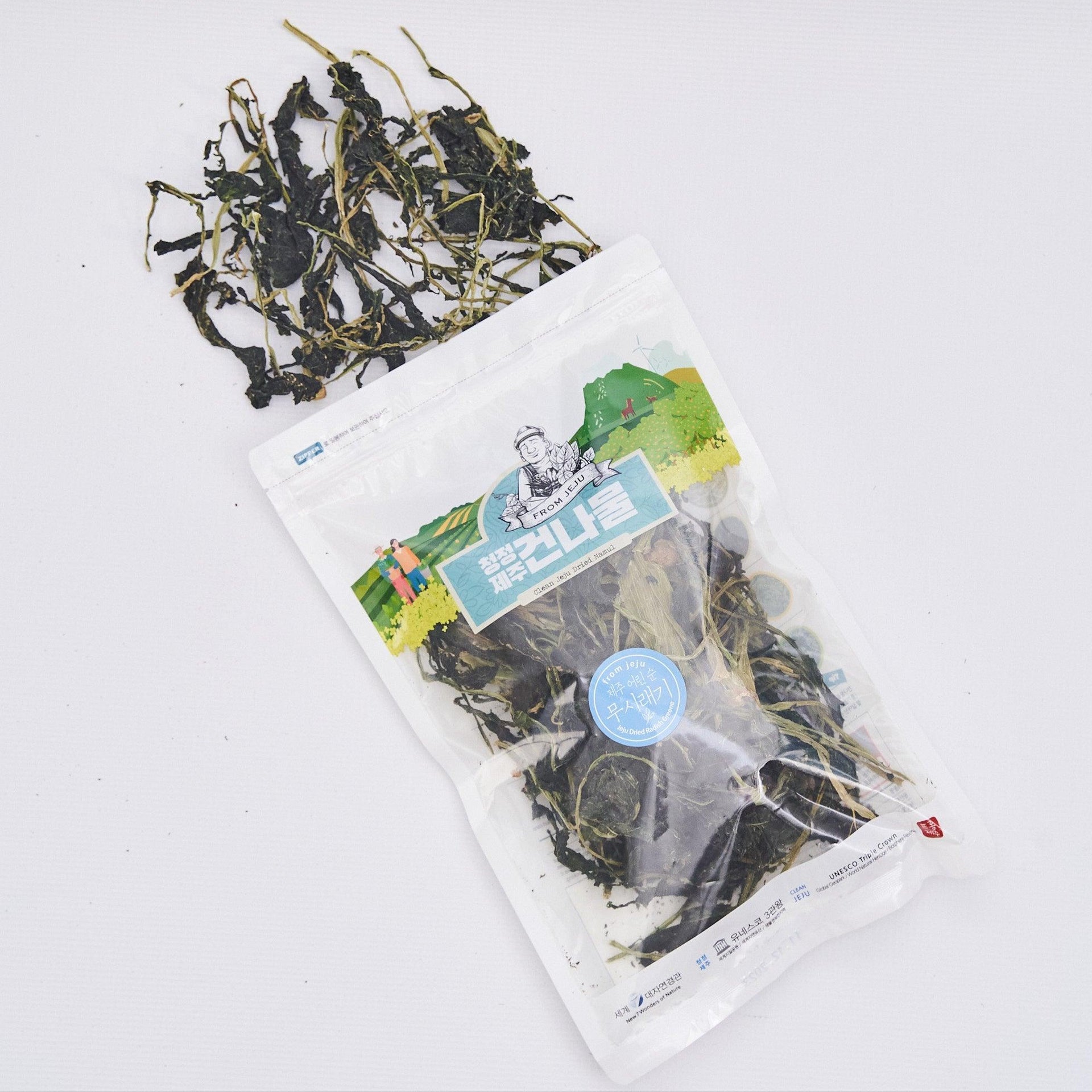 Dried chwi-namul pouch with dark twisted roots and greens scattered