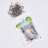 Dried chwi-namul pouch with dark thin roots piled on top