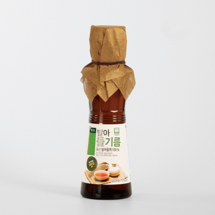 Sprouted perilla oil bottle with green label and paper-wrapped neck