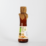 Sprouted perilla oil bottle with back label and paper-wrapped cap