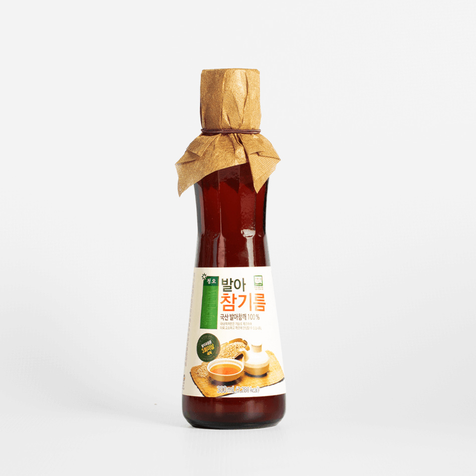 Sprouted sesame oil bottle with burlap-tied cap and front label, single bottle