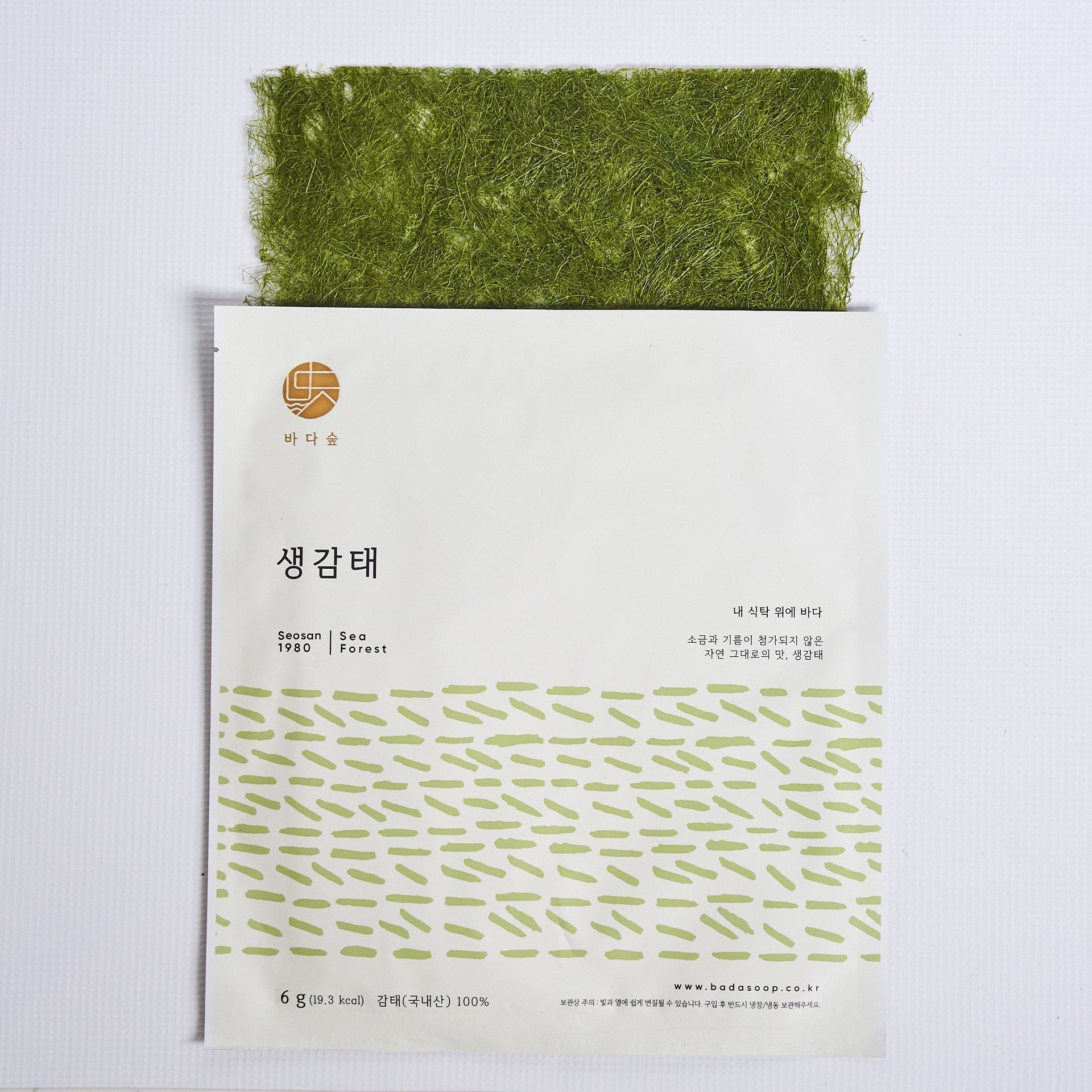 Seaweed snack pack with bright green dried sheets, stacked inside