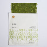 Seaweed snack pack with bright green dried sheets, stacked inside