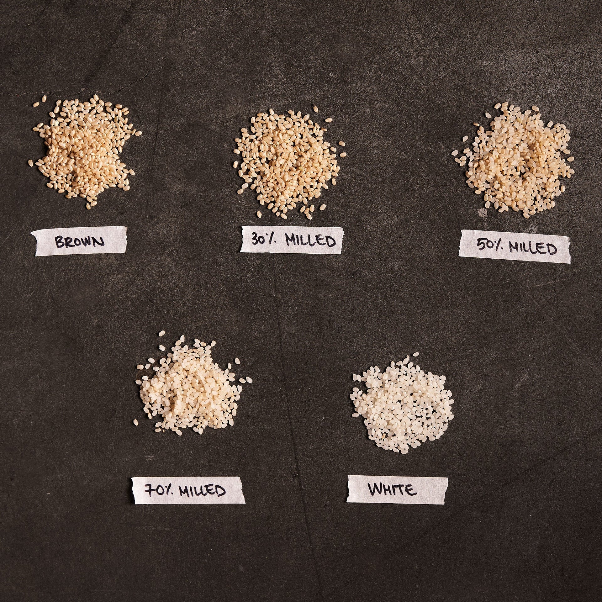 Milled rice samples showing brown, 30%, 50%, 10% bran, and white grains