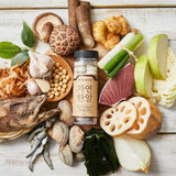 Natural seafood stock tablets bottle on a tray of seafood and vegetables