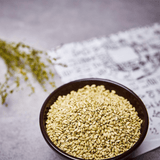 Bowl of uncooked brown rice grains