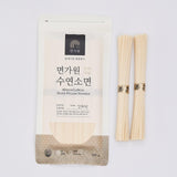Hand pulled noodle pouch with light beige uncooked noodles, single package
