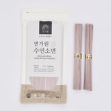 Hand pulled noodle pouch with pinkish-beige uncooked noodles, single package